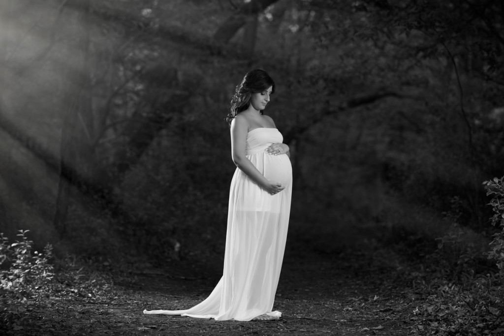 Pregnancy Photograph Of A Woman Holing Her Belly In The Forest Preserve Of Chicago
