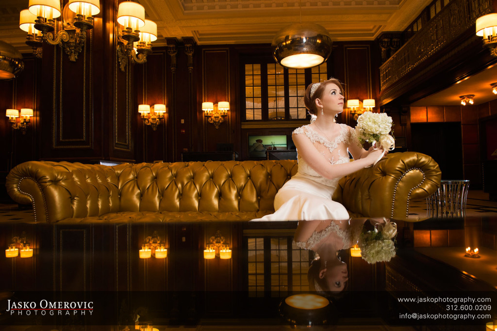 Beauty portrait of a bride sitting on a golden couch in blackstone hotel Chicago