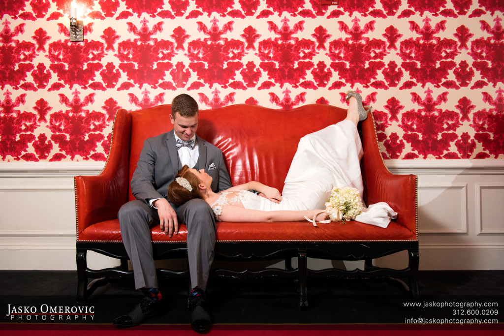 Blackstone hotel red couch with bride and groom for Chicago Wedding