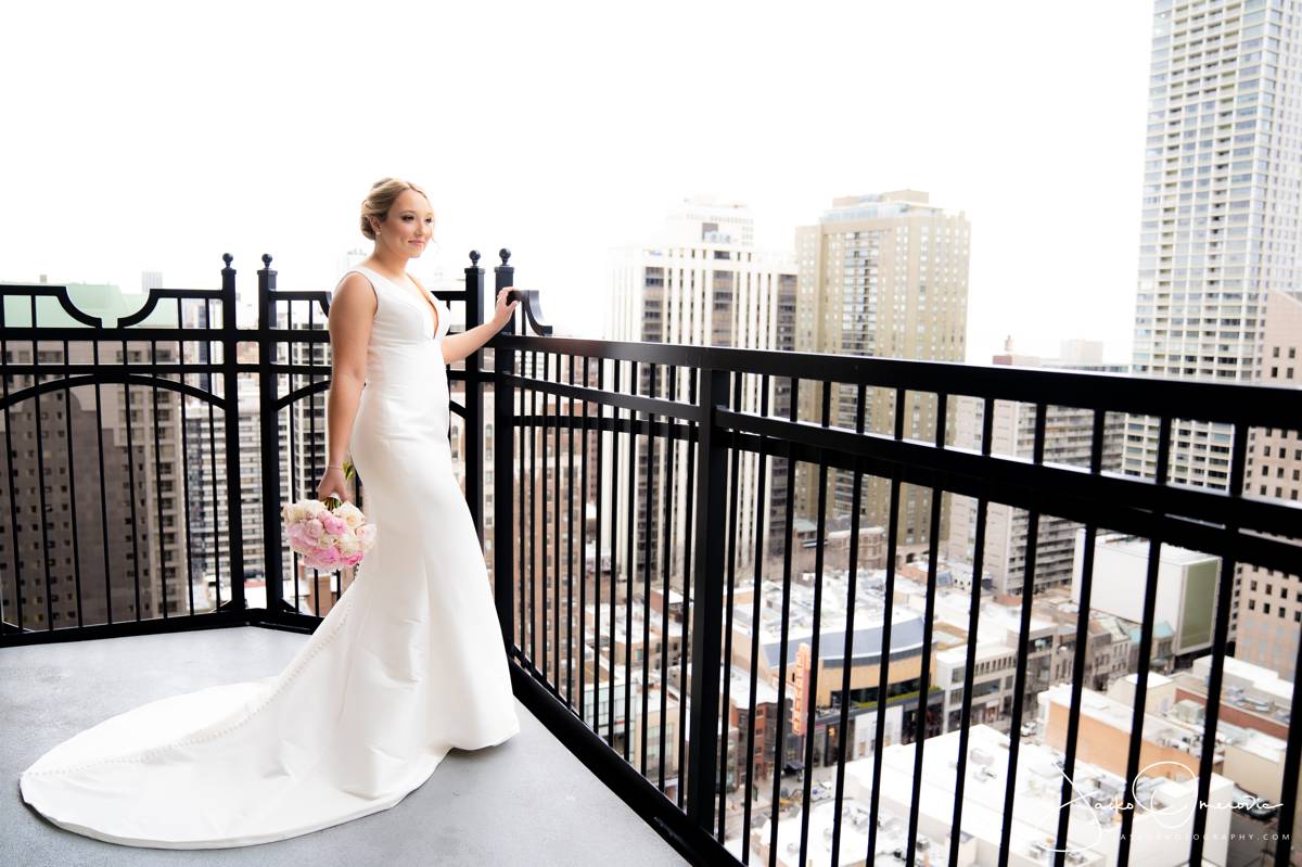 bride on the balcony with city views