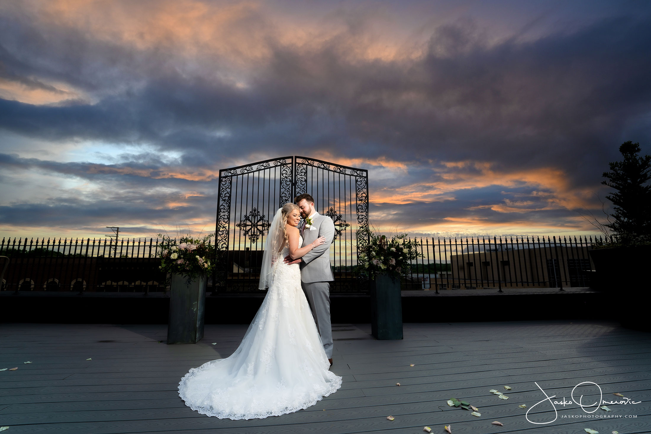 bride and groom wedding portrait at the standard in rockford with skies and sunset