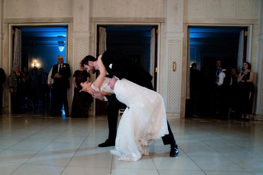 bride and groom dip to finalize their first wedding dance