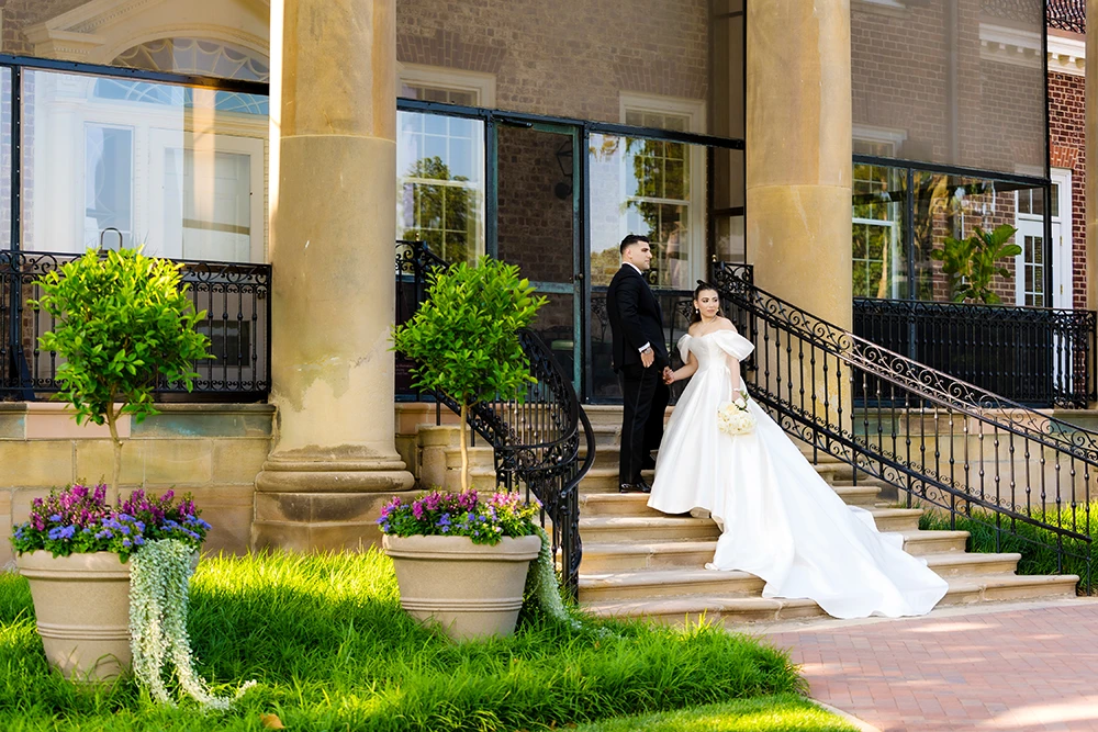 bright and colorful couple portrait at the staircase