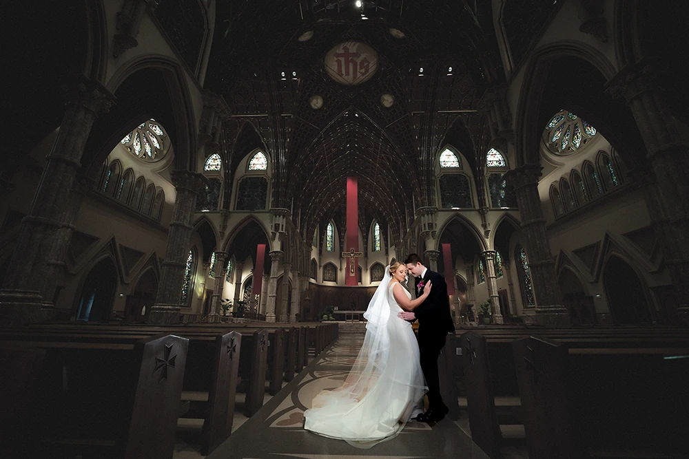 couple portrait at the church following their wedding ceremony sharing a quiet moment