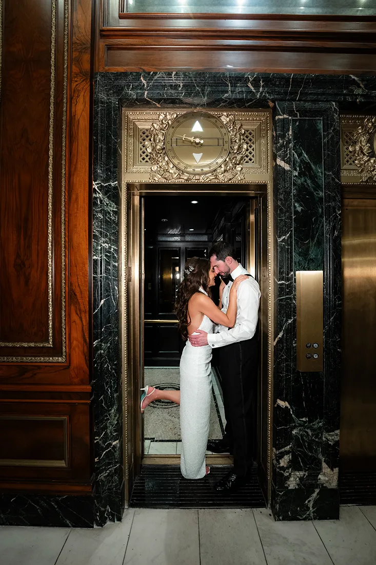 bride and groom photo by the elevator at blackstone hotel wedding - luxury chicago wedding photographer